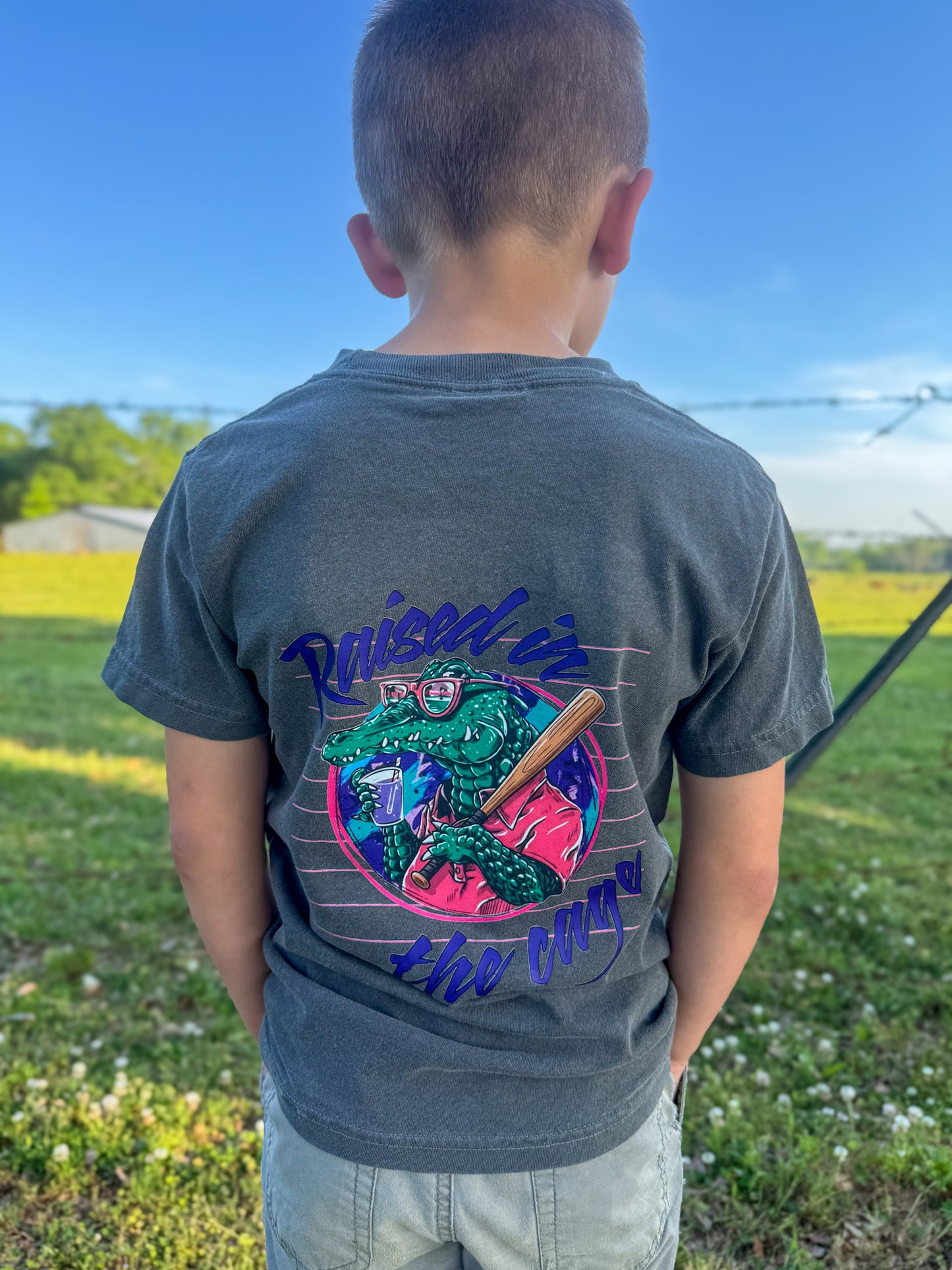 Raised In The Cage | Graphic T-Shirt